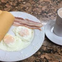 Combo #1 · Huevos fritos, tostada y café con leche con jamón o bacon. / Fried eggs, Cuban toast with mi...