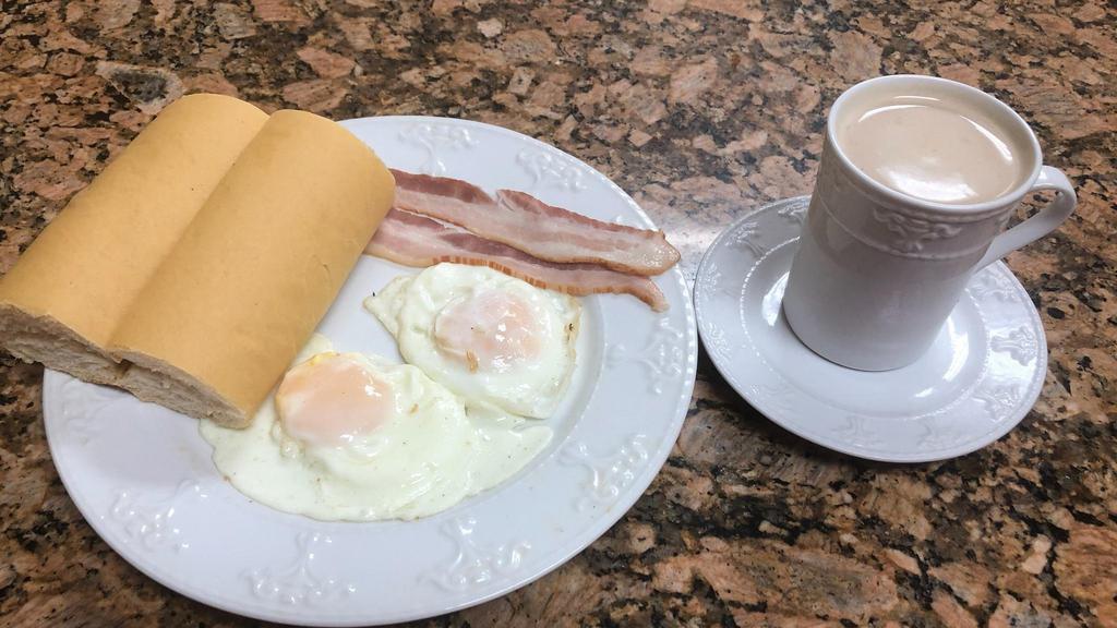 Combo #1 · Huevos fritos, tostada y café con leche con jamón o bacon. / Fried eggs, Cuban toast with milk and coffee with a choice of ham or bacon