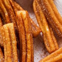 Churros · Filled with Bavarian Cream 
Tossed in cinnamon and sugar