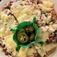 Pizza Mexicana · Crispy flour tortilla sliced and topped with Mexi-beans, delicious ground beef or our tasty ...