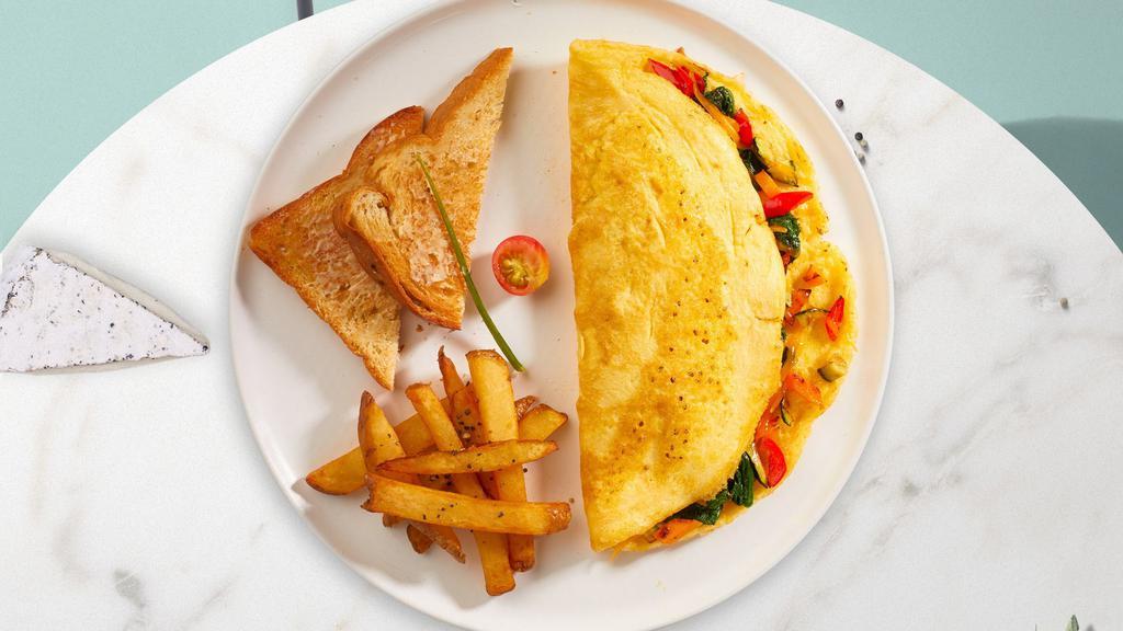 Meet The Meat Omelette · Choice of meat and cheese. Large and fluffy three egg omelette served with your choice of side.