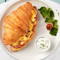 Dawn Of Cheese Sandwich · A buttery croissant with sausage, fried egg and cheese.
