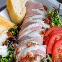 Chef Salad Plus A Drink · Sliced ham, turkey, swiss cheese, hardboiled egg, vine-ripened tomatoes, bacon, mixed greens...