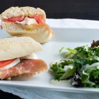 Milano Baguette Sandwich Combo · Shaved imported prosciutto ham, vine-ripened tomatoes, fresh mozzarella cheese, olive tapena...