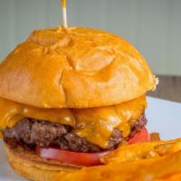 Le American Burger Plus A Drink · Beef burger topped with American cheese, crispy bacon, vine-ripened, tomatoes, caramelized o...