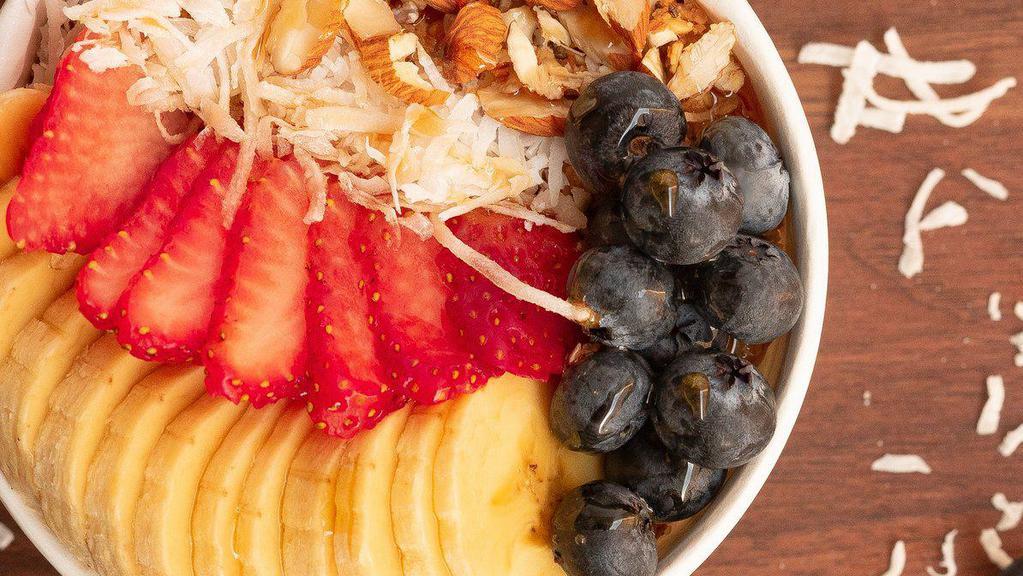Açai Na Tigela · Pure, organic açai with guarana extract topped with granola, coconut, banana, blueberries, strawberries, almonds and a drizzle of raw honey.
