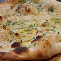 Garlic Butter Naan · Naan topped with our special garlic butter.
