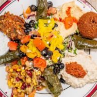 Mediterranean Platter · A sampler plate consisting of hummus, babaganush, tabouli, Mediterranean salad, dolmas, ezme...
