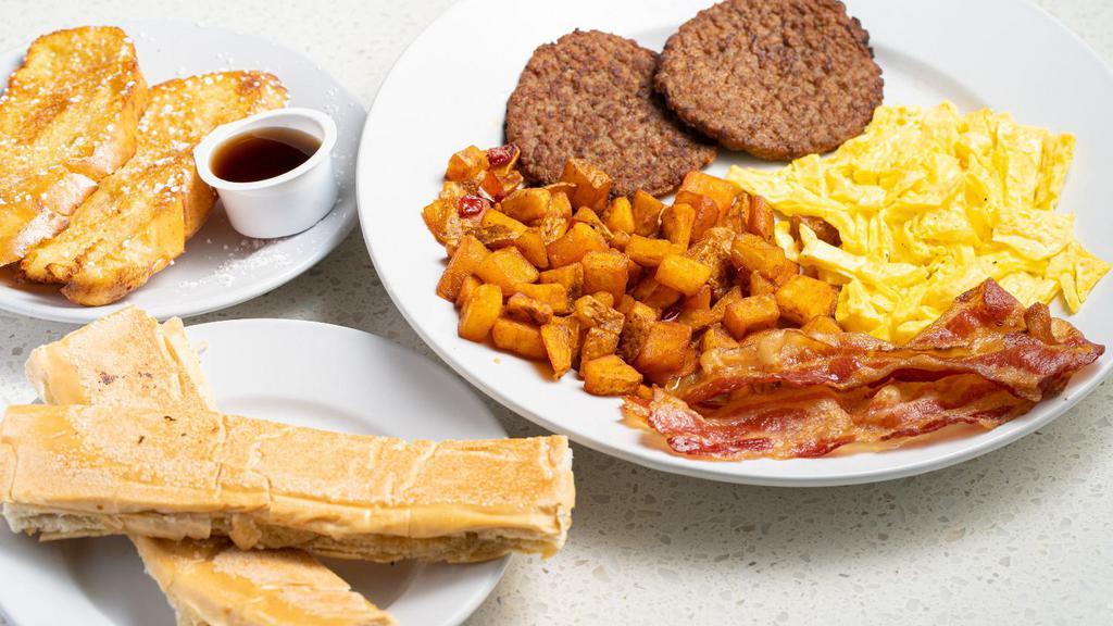 Breakfast Sampler · French Toast, Eggs, Bacon slices, Turkey Sausage, House Potatoes & Cuban toast with side of Maple Syrup