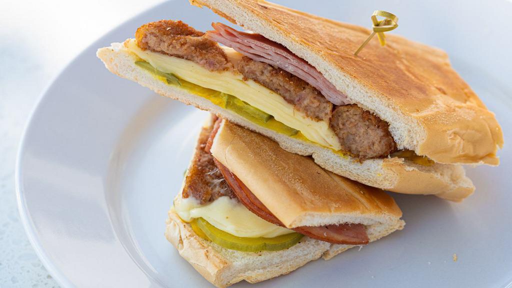 Croqueta Preparada Sandwich / Croqueta · Ham Croquettes, melted Swiss cheese, ham, mustard & pickles on toasted Cuban bread