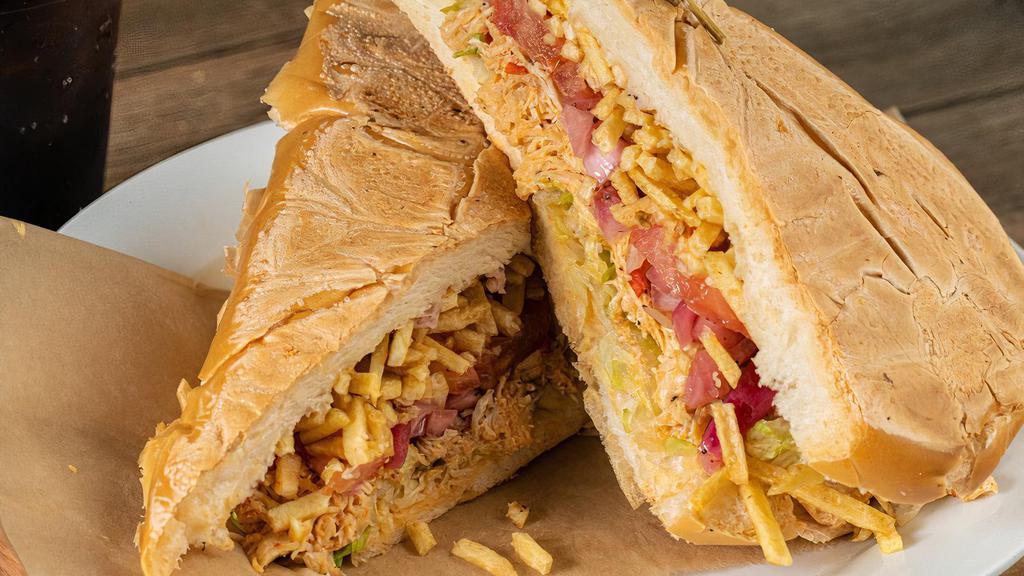 Chicken Sandwich / Pollo · Grilled OR Shredded Chicken Breast, Lettuce, Tomatoes, Marinated Onions & Potato Sticks on Toasted Cuban Bread