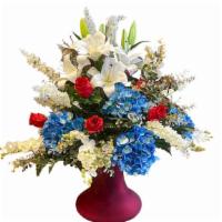 Liberty Reigns · Patriotic and gorgeous white oriental lilies, snapdragons and orchids mixed
with blue hydran...