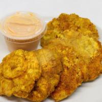 Tostones · Fried green plantains served a side of chipotle ranch sauce