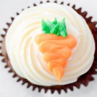 Carrot Cake Cupcake · Carrot cake, frosted with cream cheese, and garnished with pecans and a frosting carrot. Not...