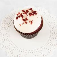Red Velvet Cupcake · Red velvet cake, frosted with cream cheese, and garnished with pecans.