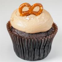 Salted Caramel · Chocolate cake topped with caramel icing and garnished with sea salt and crushed pretzels.