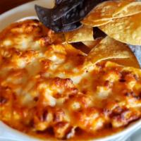 Buffalo Chicken Dip · Grilled chicken, blue cheese, cheddar and corn tortilla chips.