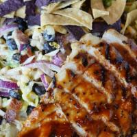 Southwest Chicken Salad · BBQ chicken, romaine, bacon, black beans, grilled corn, grape tomatoes, red onion, cheddar, ...