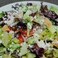 Greek Salad · Mixed greens, cucumbers, tomatoes, red onion, olives, feta cheese, seasoned pita crisps and ...