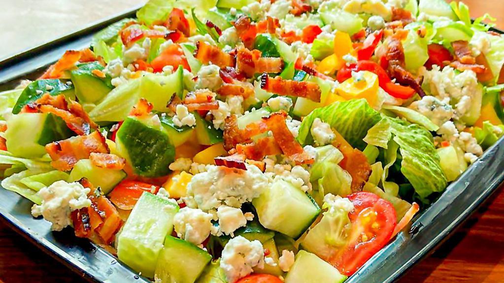 House Salad · romaine, iceberg, cucumbers, grape tomatoes, peppers, blue cheese crumbles, applewood smoked bacon, mustard vinaigrette