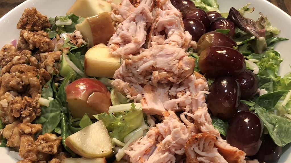 Roasted Turkey Waldorf Salad · Pulled Boar's head brand turkey, mixed greens, celery, red onion, grapes, apples, cheddar cheese, candied walnuts and country dressing.