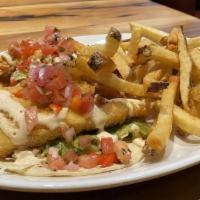 Fish Tacos · fried or bronzed haddock, guacamole, pickled red onion, crema, tomato jalapeño relish, hot s...
