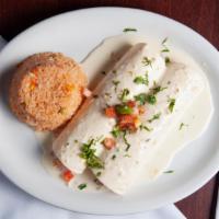 Burrito De La Casa Adobado · Two soft flour tortillas filled with pico de gallo and delicious chicken marinated in adobo ...