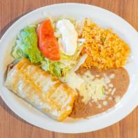 Chimichanga · One chicken or beef chimichanga served with rice and refried beans, lettuce, tomatoes, sour ...