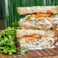 Thunnus · Tuna mayo salad sandwich with carrot on a multigrain bread and a mix green salad.
