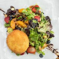 Citrus · Spring mix, mandarin, mix berries, almonds, crusty goat cheese and passion fruit dressing.