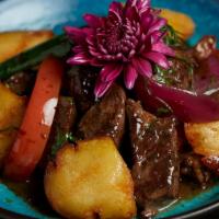 Lomo Saltado · Tenderloin with red onion, tomato and peppers.