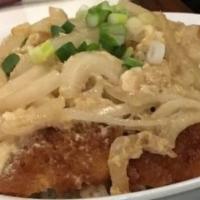 Katsu Don · Choice of chicken or pork served on top of rice with onion and egg sauce. Served with Miso s...