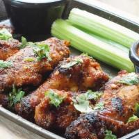 Lemon Pepper Wings · Full pound of spicy marinated grilled wings tossed with lemon pepper sauce with ranch or blu...
