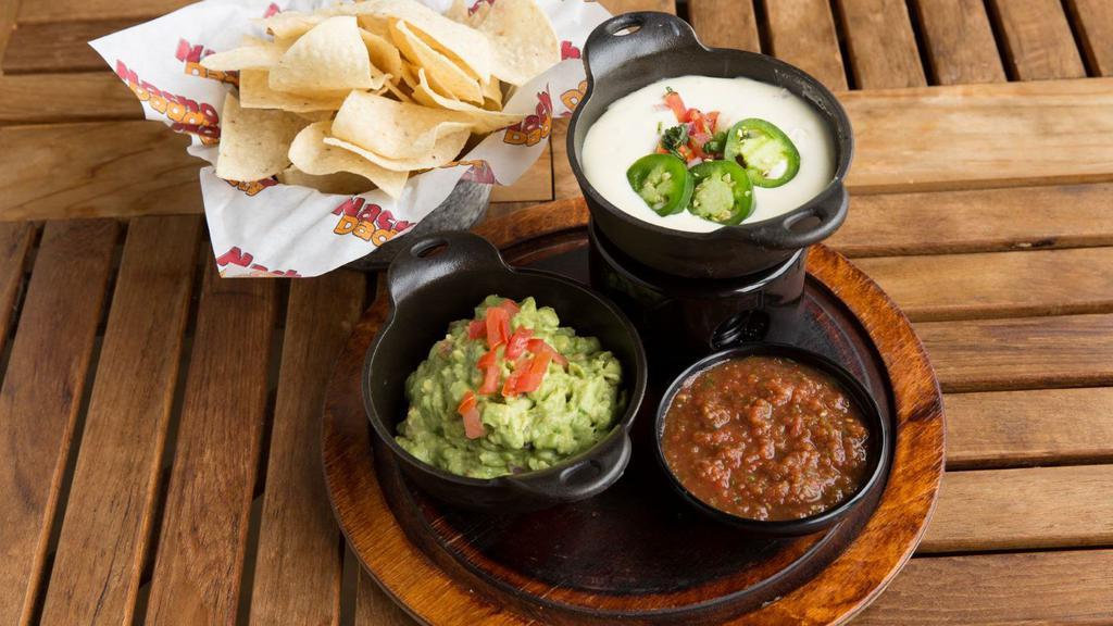 Triple Dip · Guacamole, queso dip, salsa, and house-made chips.