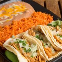 Street Taco Combo · 3 mini corn tortillas served with favorite protein. Served with Mexican rice and refried bea...