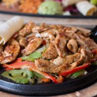Marinated Chicken Fajitas · Served with fajita peppers and onions, sour cream and guacamole with a side of Mexican rice ...