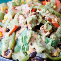 Vegan Chick’N Nachos · Marinated chicken, vegan queso, black beans, red and green bell peppers, onions, mushrooms, ...