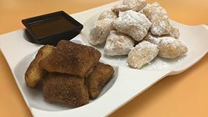 Zeppolins · Flash fried house made dough, dusted with powder sugar and served with chocolate, raspberry ...