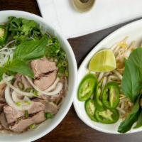 Pho Tai Nam · Eye round rare, beef flank noodle soup.