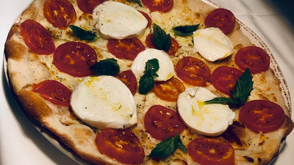 Caprese Pizza · Mozzarella di bufala, fresh tomatoes, basil.