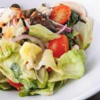 Garden Salad · Iceberg and romaine mix, cherry tomatoes, cucumbers, carrots, onions, roasted peppers, mushr...