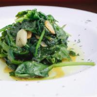 Spinach · Fresh spinach sautéed with fresh garlic and extra virgin olive oil.