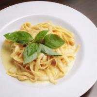 Fettuccine Alfredo · Fettuccine pasta served in a rich and creamy alfredo sauce.