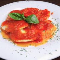 Baked Cheese Ravioli · Ravioli filled with a blend of indulgent cheeses, topped with our homemade marinara sauce.