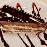 Chocolate Mousse Cake · Moist Chocolate cake layered with a light and fluffy dark chocolate mousse with a thin layer...