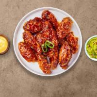 Kpop Wings · Fresh chicken wings fried until golden brown, and tossed in soy sauce, brown sugar, honey, a...