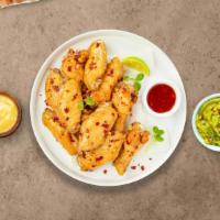 Netflix And Sweet Chili Wings · Fresh chicken wings fried until golden brown, and tossed in sweet chili sauce. Served with a...