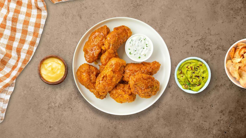 Mango In The Night Habanero Wings · Fresh chicken wings fried until golden brown, and tossed in mango habanero sauce. Served with a side of ranch or bleu cheese.