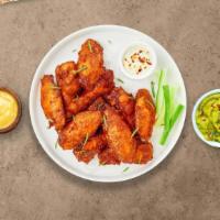 Clucking Wings · Fresh chicken wings fried until golden brown. Served with a side of ranch or bleu cheese.