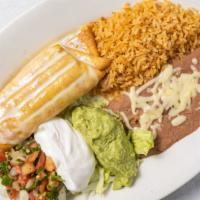Chimichanga · Stuffed flour tortilla with your choice of chicken or beef, deep-fried and topped with chees...